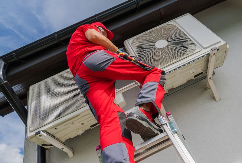 HVAC technician servicing an AC unit in Austin